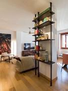 Airport modular bookcase with floor-to-ceiling uprights in black embossed metal - customer photo