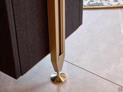 The painted metal upright rests on a chrome-plated floor plate