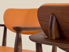 Detail of the backrest and armrests handcrafted to look like a single element enveloping the seat and backrest