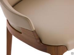 Detail of the solid walnut wood structure that joins the side wings of the upholstered backrest