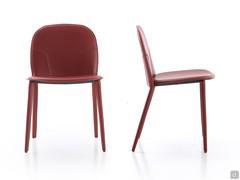 Front and side view of the Makalu armless chair, highlighting its low, curved backrest 