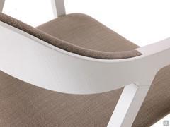 Detail of the curved ash plywood backrest that joins the armrest and legs in a single workmanship