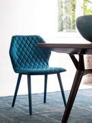 Armless chair Cloe with hexagonal-shaped wraparound backrest