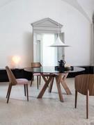 Wood chairs Nadine paired with the Larkin table for a refined dining room with contemporary flair