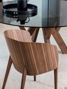 Detail of wooden living room armchair Nadine with canaletto walnut shell