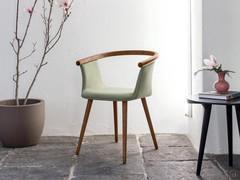 Design chair Freya with tubular element made of curved solid ash wood that defines the back and arms