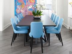 Chairs June in turquoise fabric with wooden legs combined with an elegant dining table