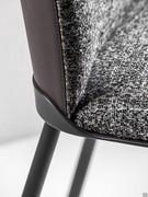 Detail of Cantori's upholstered chair Oasi: the metal band common to all elements of the collection