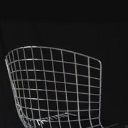 Wire Chair created by Harry Bertoia and made with welded chromed rods.