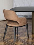 Turner upholstered chair with oak wood legs, upholstered in fabric and paired with the Viper table