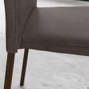 Close-up of the Letty chair with stitching which follows the lines of the seat and back