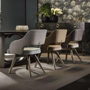 Upholstered armchairs Adria by Cantori perfect for a dramatic dining room