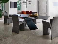 Fabric-covered chair with armrests Ketch by Bonaldo to match the Ax table, in the armless model