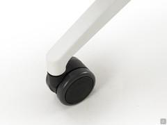 Detail of the white painted aluminium base with black casters