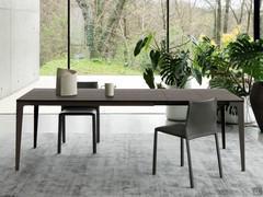 Dining room with chairs Corinne in 1031 Ghisa leather paired with Jake extension table