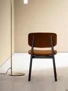 Back view of Harriet modern chair - the inwards vertical oblique element makes the chair slender