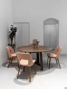 Vence chairs in walnut-stained beech combined with a round dining table