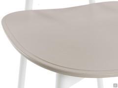 Detail of the thin and ergonomic seat in coloured plastic material