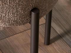 Detail of tubular metal legs painted mocha shine