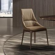 Lora upholstered chair with stitching and wooden legs