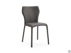 Front view of the Miele padded chair with hexagonal backrest. Legs and seat are fully upholstered in leather.