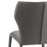 Close up of the back of the Miele padded chair with hexagonal backrest. Legs and seat are fully upholstered in leather, with a zip at the back of the backrest which extends below the seat.