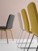 Detail of Kate chair in the version with metal sled legs and with wooden legs