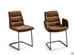 Dama chair with upholstered seat in leather. Cantilever base in titanium varnished metal. With and without armrests. 