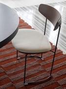 Design chair with upholstered Keel seat with solid stained ash wood backrest