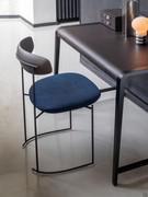 Design chair with upholstered Keel seat under Linus desk