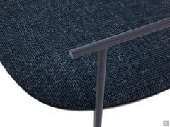 Detail of the armrest of the Keel armchair, in metal like the rest of the frame and available in different colours