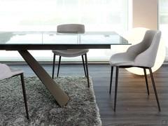 Side and rear view of the Count chair with Joint fabric upholstery and corten painted metal legs