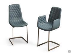 Will diamond-quilted upholstered chair, with and without armrests. Leather upholstery and metal cantilever base in the Titanium finish.