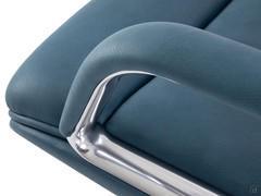 Detail of fixed aluminum armrest with leather-covered support to match the seat