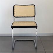 The Cesca B32 Chair by Marcel Breuer - rattan seat with black lacquered beechwood edge