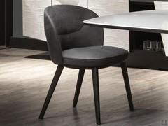 Elegant silhouette of Cantori's Shiba chair with slightly curved back and wide, soft seat