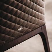 Detail of the quilting on the backrest of the Arcadia chair by Cattelan in the models without armrests