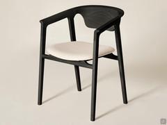 Ashina chair in black ash solid wood with covered seat.