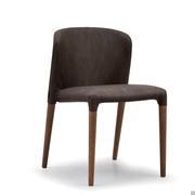 Claire upholstered chair available in the version with visible wooden legs