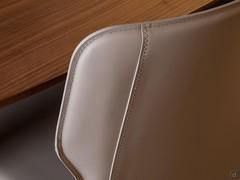 Detail of the shaped backrest and stitching to match the real leather upholstery