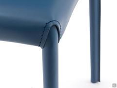 Detail of the connection between upholstered legs and seat