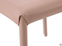 Detail of the connection between upholstered legs and seat