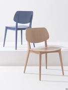 Chloe designer chair with a wooden structure, seat and backrest