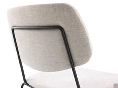 Details of the section behind the backrest of the Chloe chair; spacious and upholstered to increase comfort