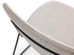 Details of the backrest of the Chloe chair upholstered in fabric