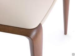 Detail of the rounded outline of the two back legs that nicely connect with the upholstered seat