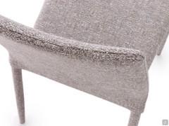 Detail of the high upholstered backrest of the Akira 2.0 chair