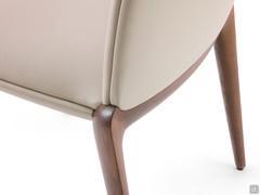 Detail of the connection between the wooden back legs and the upholstered seat and back shell