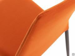 Detail of the thickness of the high, upholstered backrest