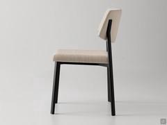 Side view of the Omnia upholstered kitchen chair with painted die-cast aluminium frame